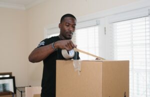 mover packing a box ready to be relocated to florida
