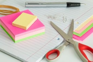 Scissors and sticky notes - some of the packing supplies you must have