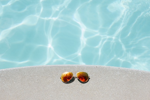 Sunglasses by a pool.